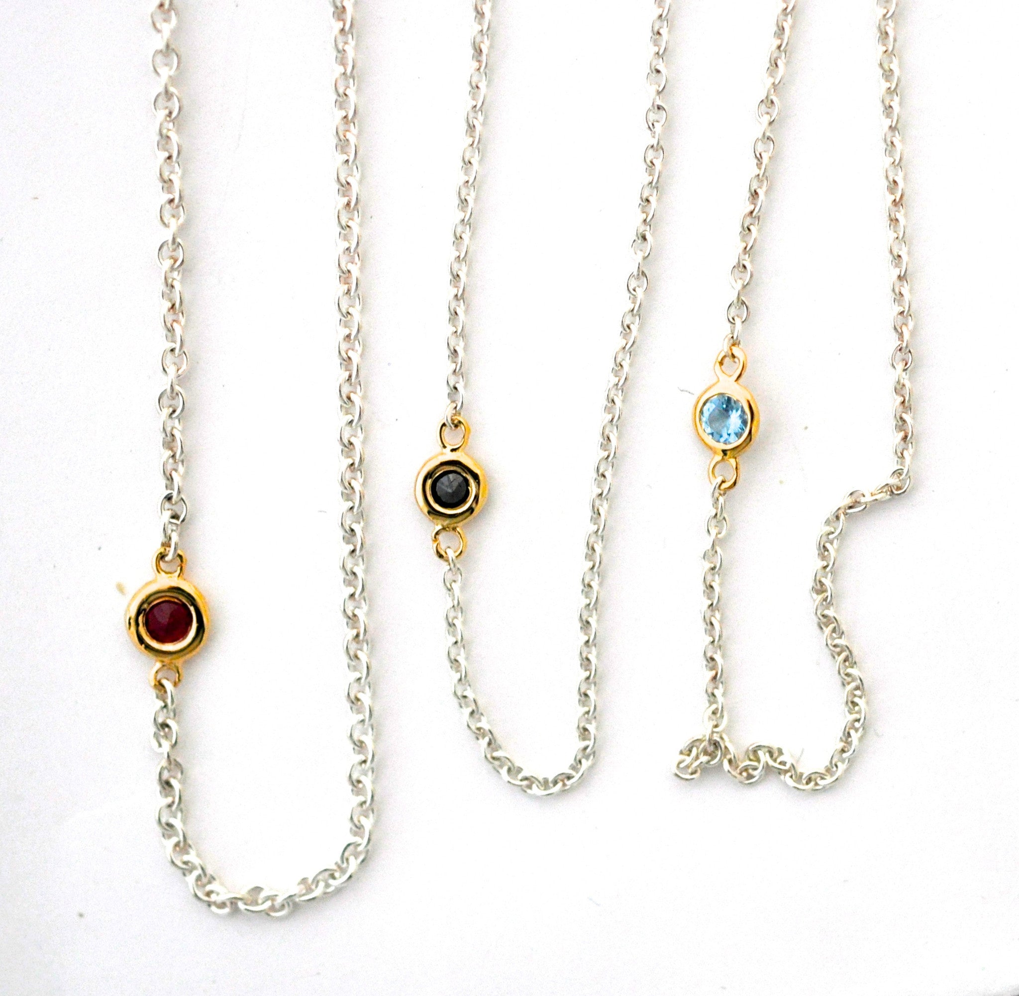 necklace / silver + small gemstone in gold bezel