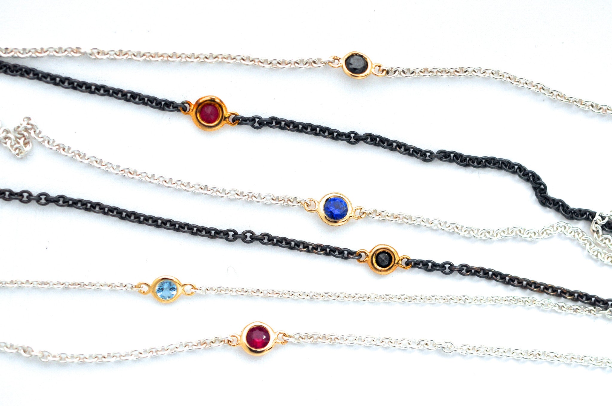 necklace / silver + small gemstone in gold bezel